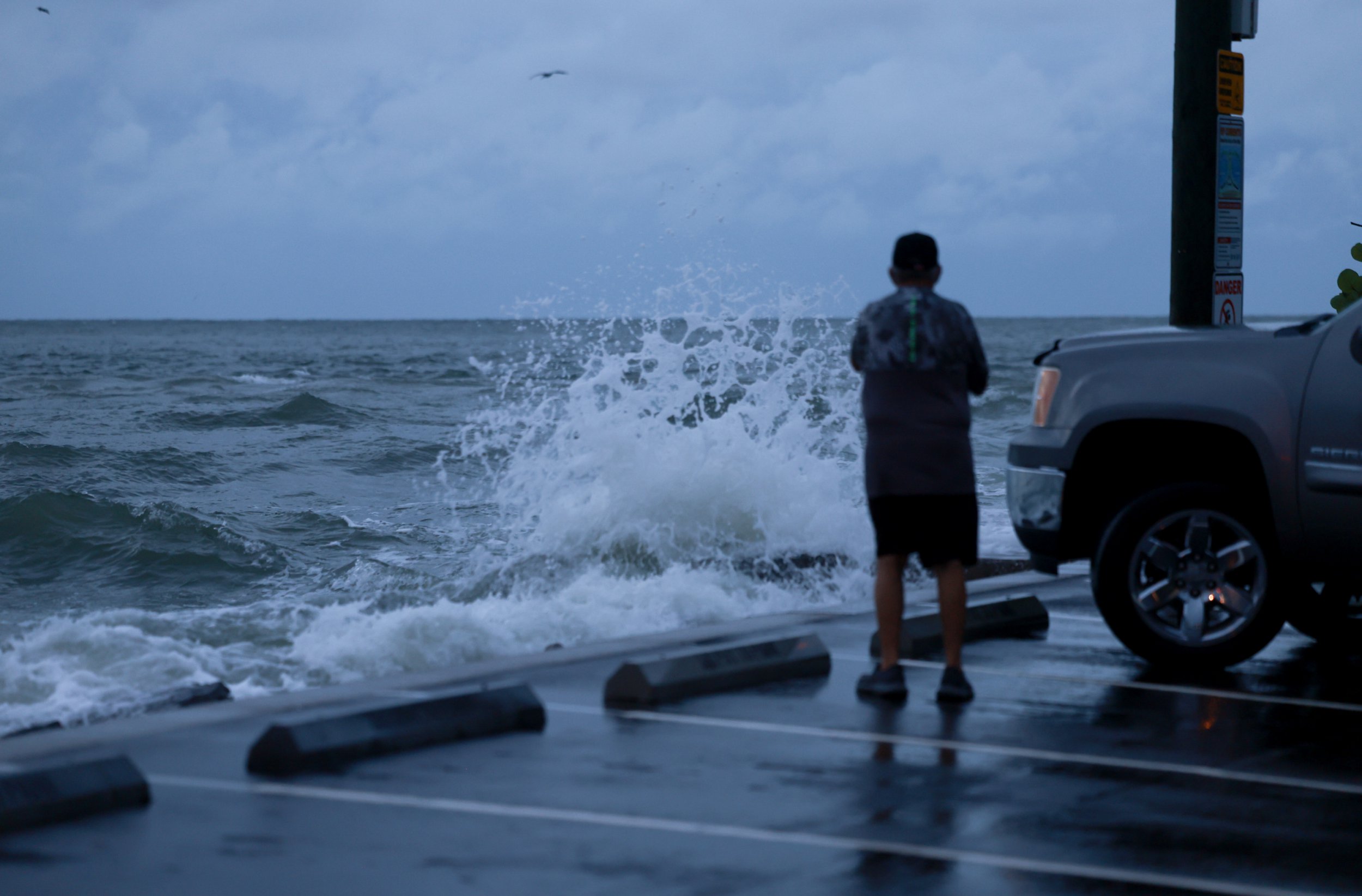 ST PETE BEACH, FLORIDA - SEPTEMBER 26: A person looks out at the Gulf of Mexico waters as Hurricane Helene churns offshore on September 26, 2024 in St. Pete Beach, Florida. Later today, Helene is forecast to become a major hurricane, bringing the potential for deadly storm surges, flooding rain, and destructive hurricane-force winds along parts of the Florida West Coast. (Photo by Joe Raedle/Getty Images)